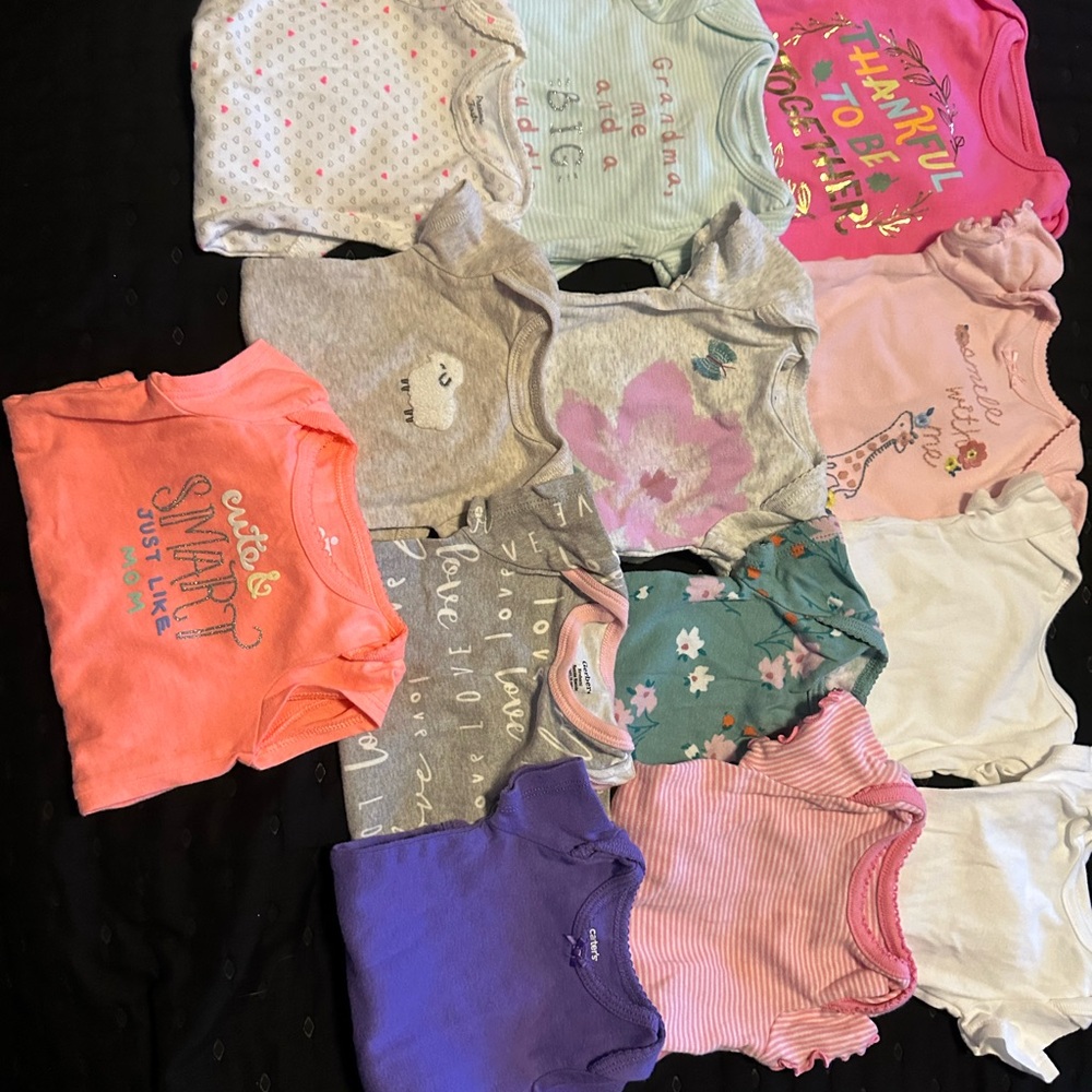 Assorted Baby Onesies in Various Colors